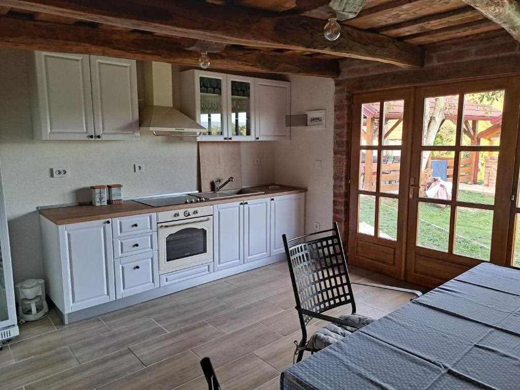 Kokot's cottage is a holiday house with three wooden buildings, barbecue, jacuzzi
